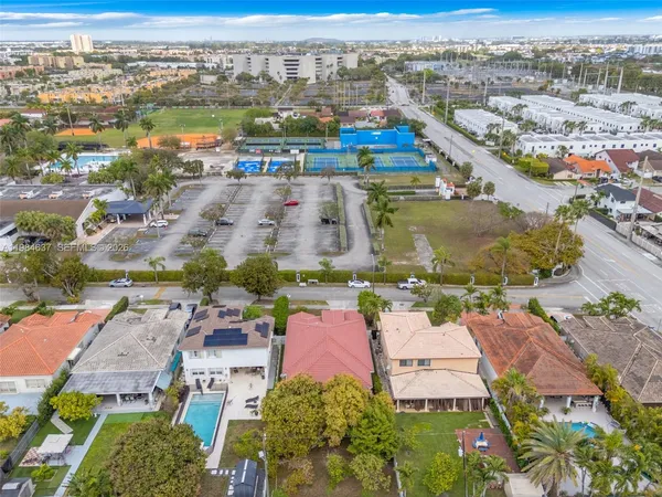 an aerial view of residential building and ocean view