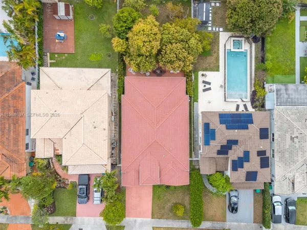 an aerial view of residential houses with outdoor space