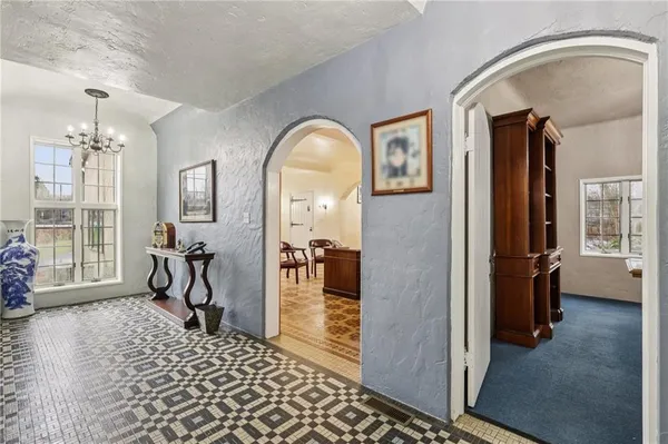 a view of a livingroom with furniture and front door