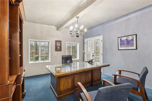 a dining room with furniture and window