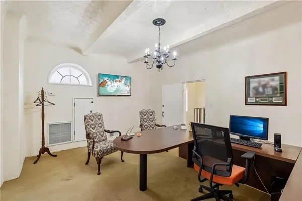 a view of a workspace with furniture