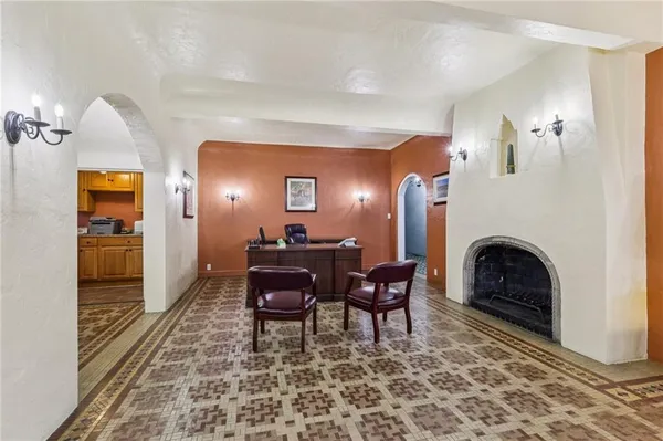 a view of a livingroom with furniture and a fireplace
