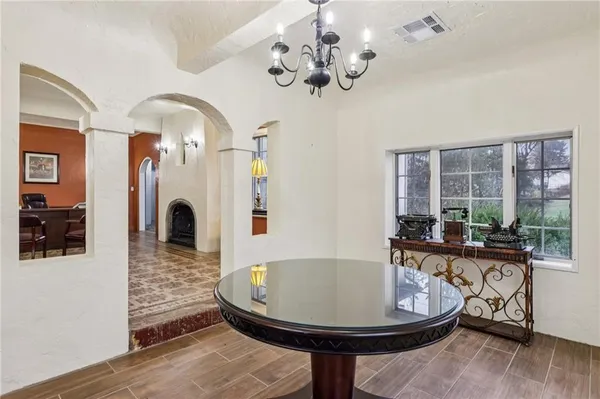 a view of a livingroom with furniture window and wooden floor