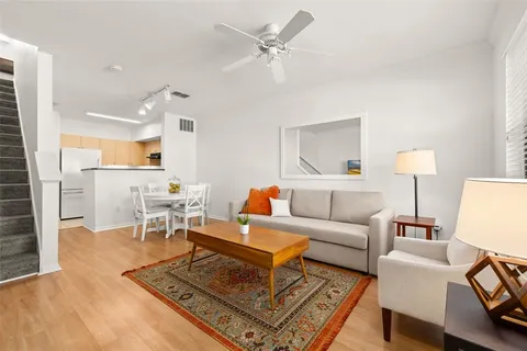 a living room with furniture and a table
