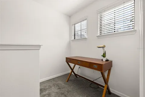 a room with a table and windows