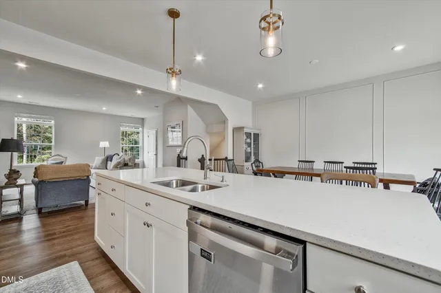 a kitchen with a sink appliances and a counter top space