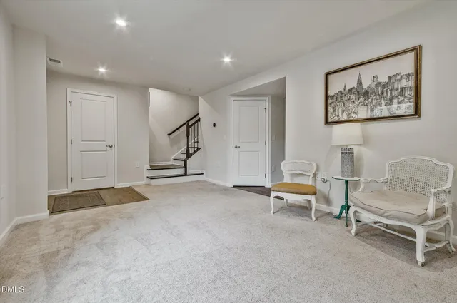 a view of an empty room with a bench