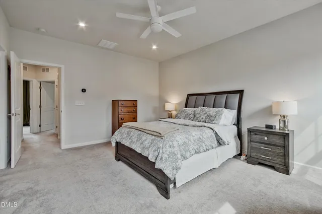 a living room with a bed furniture and a window