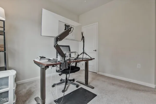 a view of a workspace with furniture