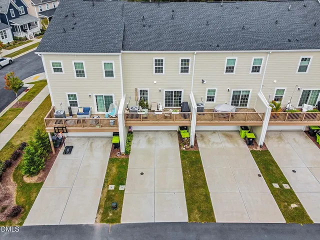 a view of a backyard with swimming pool