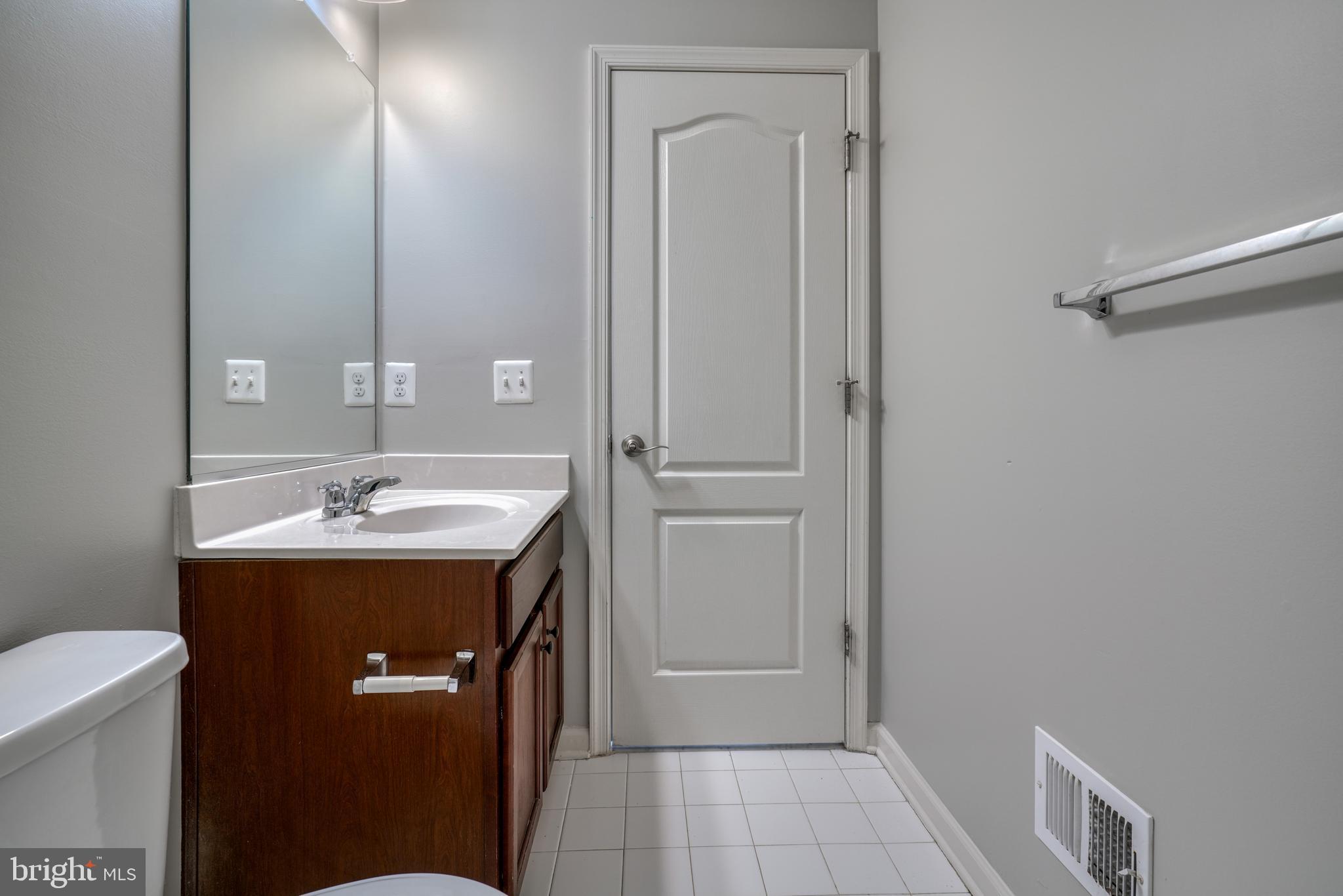 985 Morgan Run Road Middle River, MD 21220 - Photo 23 of 33 a bathroom with a sink a toilet and shower