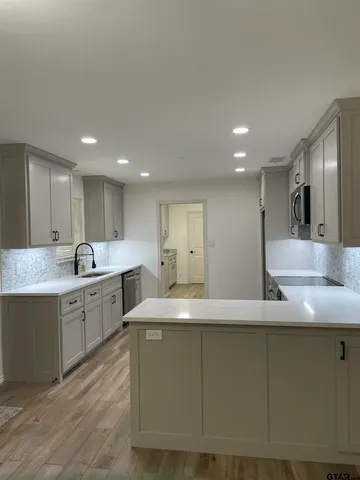 a large kitchen with cabinets