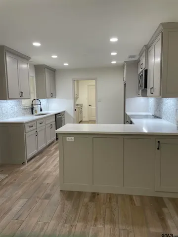 a large kitchen with cabinets