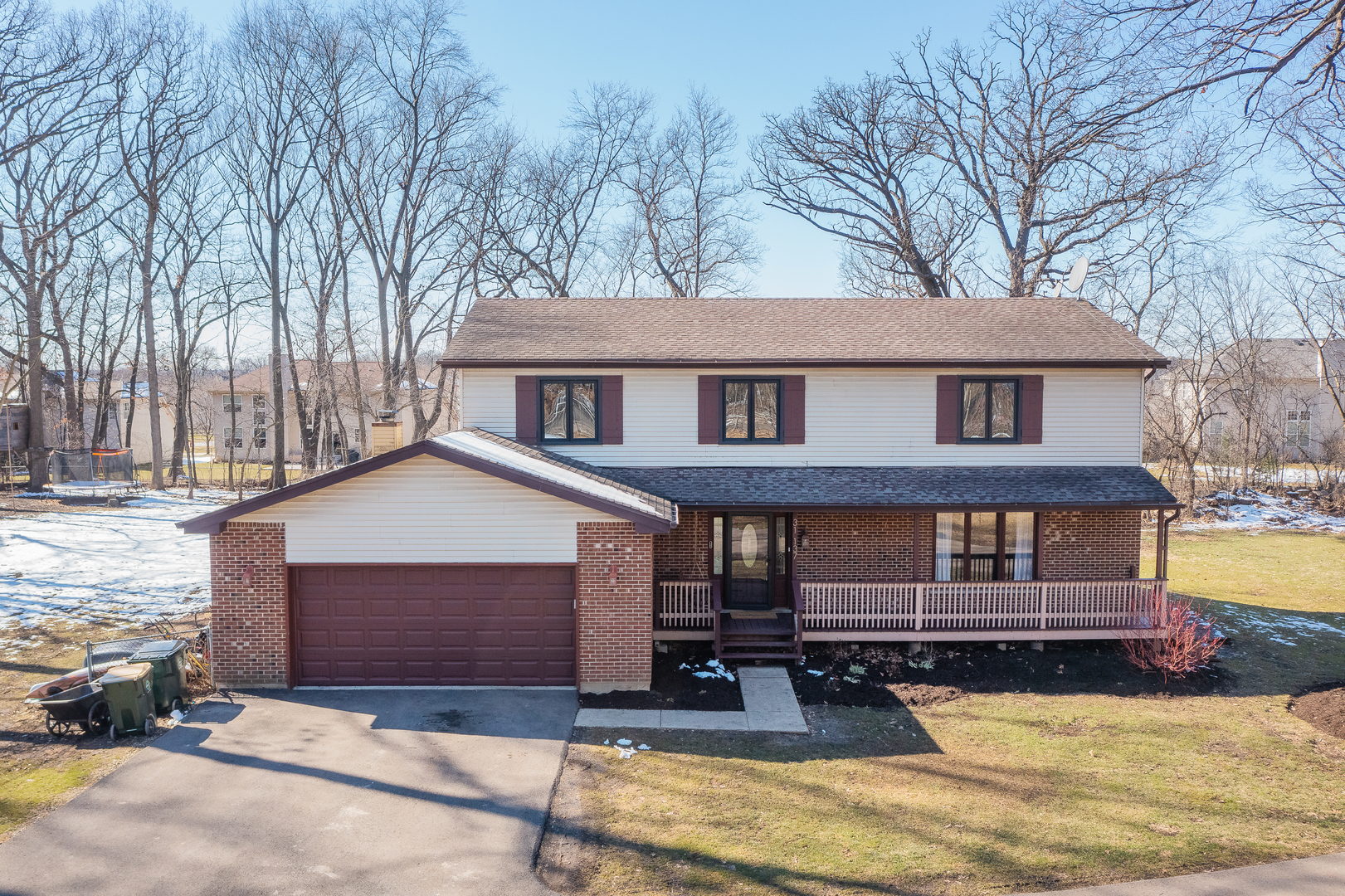 31W137 Rohrssen Road Hoffman Estates, IL 60192 - Photo 2 of 43 a front view of a house with yard and trees in the background