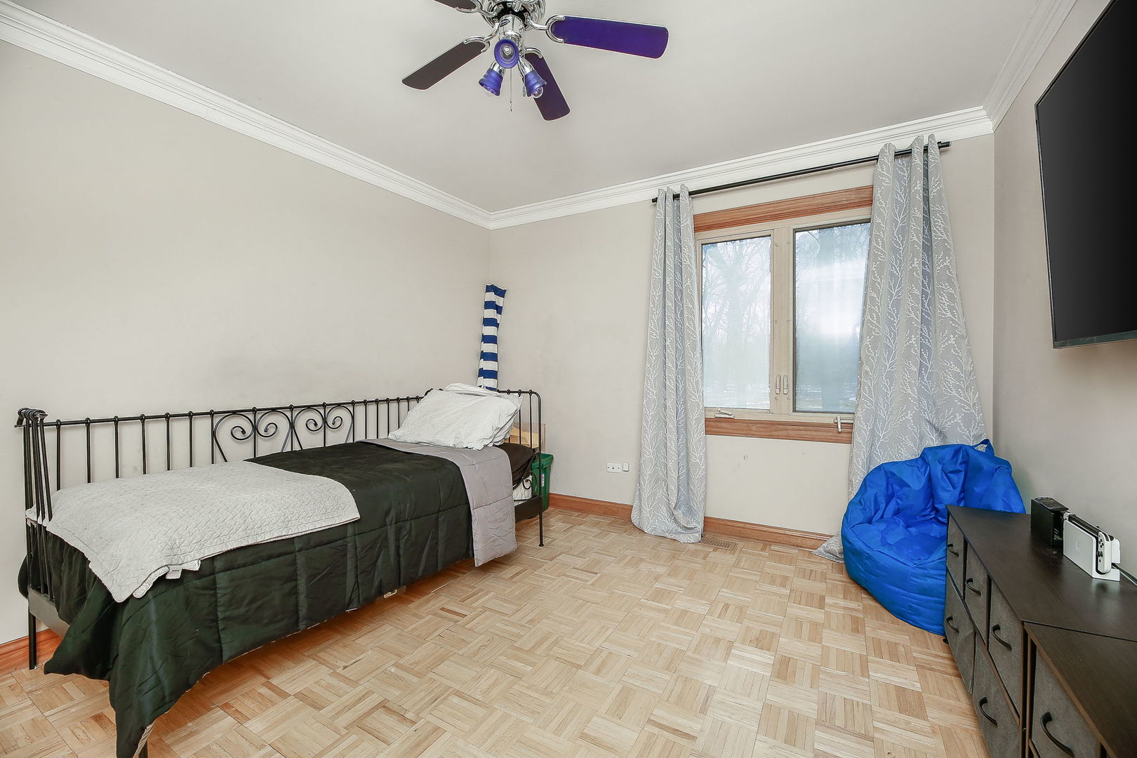 31W137 Rohrssen Road Hoffman Estates, IL 60192 - Photo 21 of 43 a bedroom with a bed and a chandelier