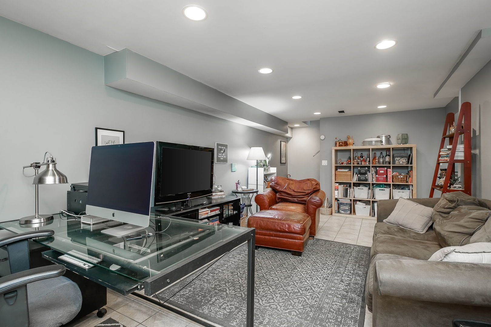 31W137 Rohrssen Road Hoffman Estates, IL 60192 - Photo 23 of 43 a living room with furniture and a flat screen tv