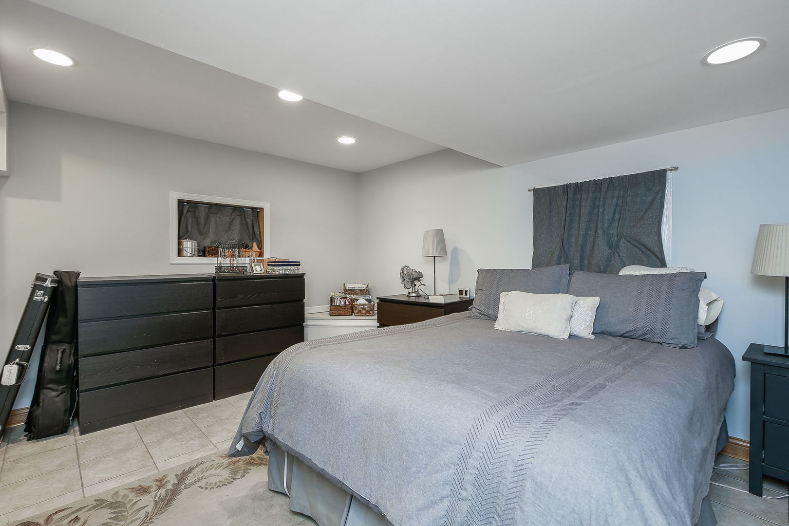 31W137 Rohrssen Road Hoffman Estates, IL 60192 - Photo 24 of 43 a bedroom with a bed and furniture