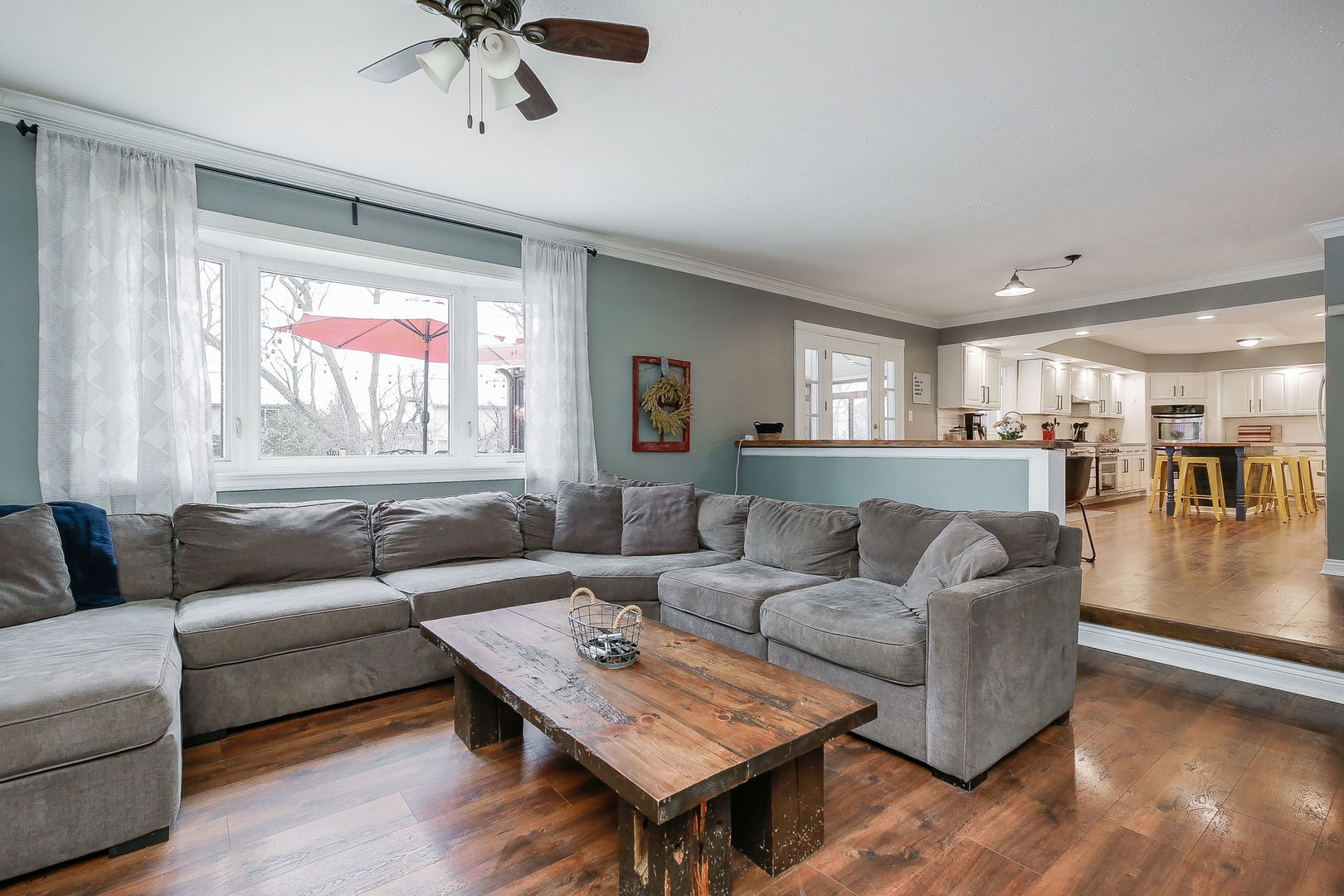 31W137 Rohrssen Road Hoffman Estates, IL 60192 - Photo 6 of 43 a living room with furniture and a large window