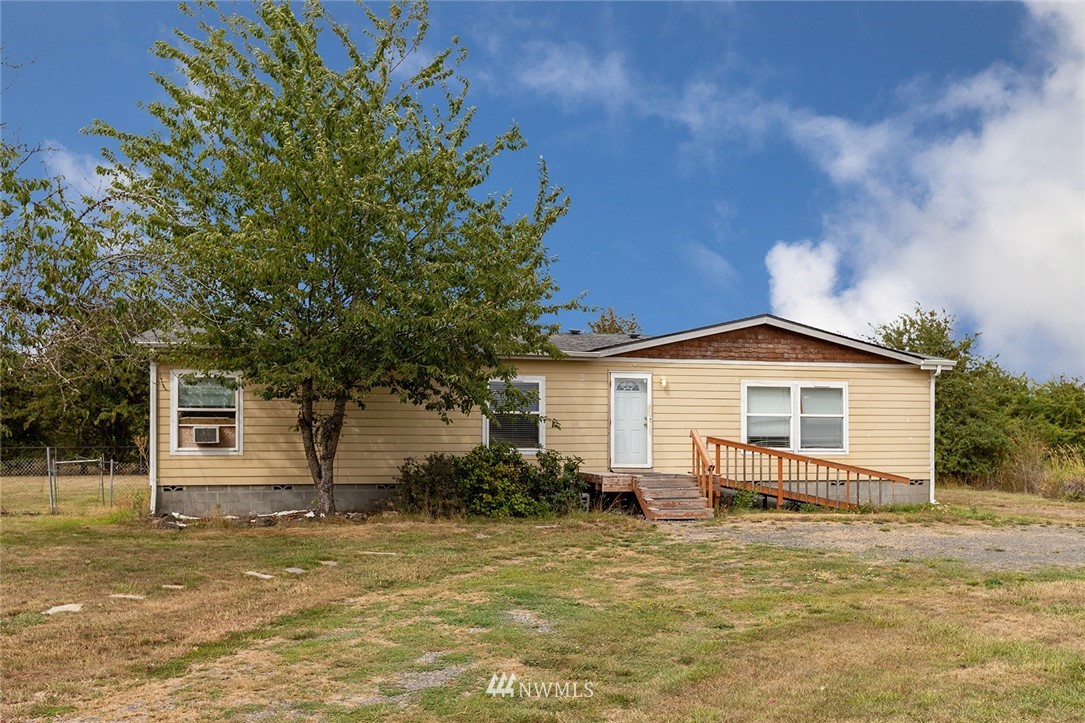 2011 Bishop Road Chehalis, WA 98532 - Photo 1 of 25 a white house that has a tree in front of it