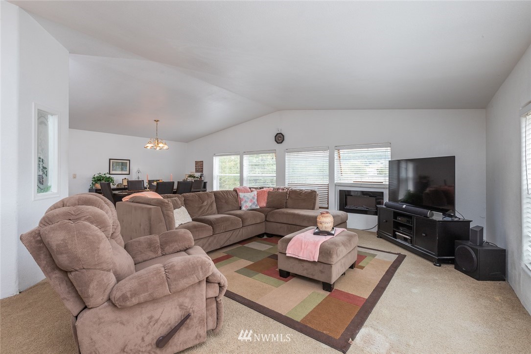 2011 Bishop Road Chehalis, WA 98532 - Photo 2 of 25 a living room with furniture and a flat screen tv