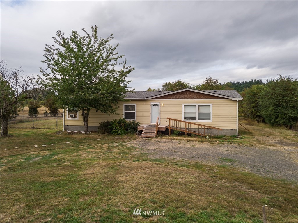 2011 Bishop Road Chehalis, WA 98532 - Photo 20 of 25 a view of a house with a backyard