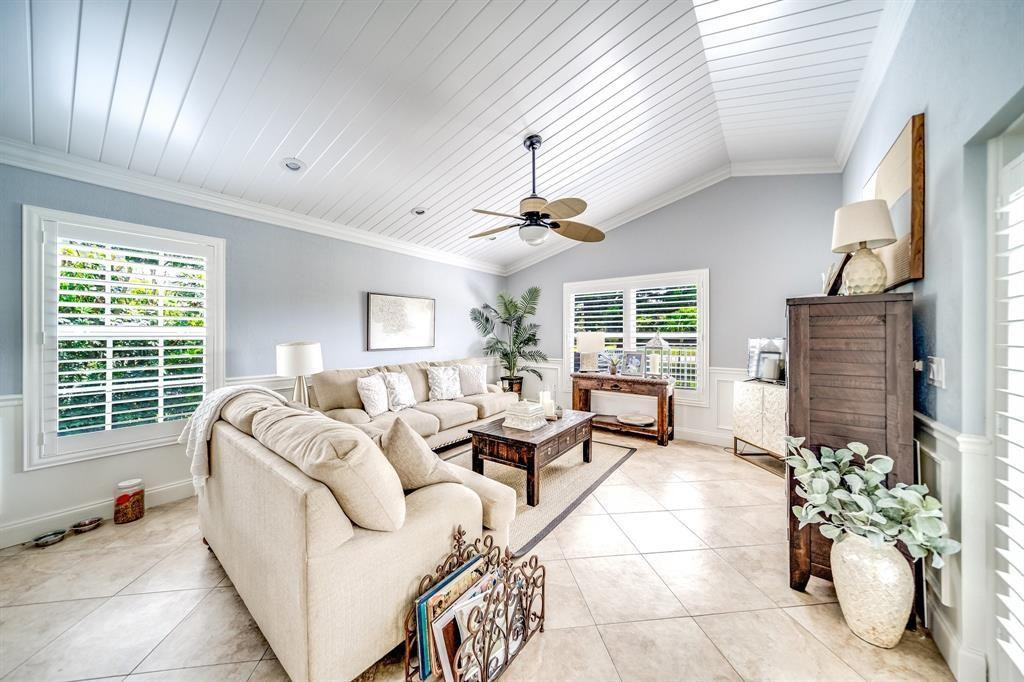 12036 Quilting Lane Boca Raton, FL 33428 - Photo 11 of 25 a living room with furniture and a large window