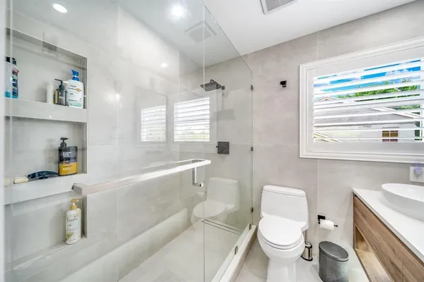 a bathroom with a sink a toilet and a bathtub