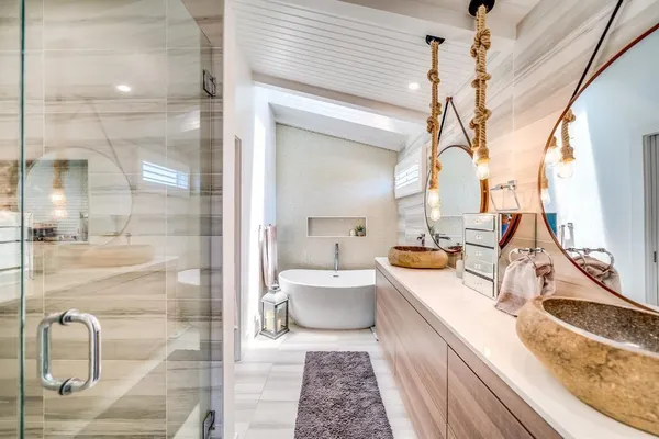 a bathroom with a sink a toilet and mirror