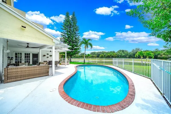 a view of a swimming pool with a lounge chairs