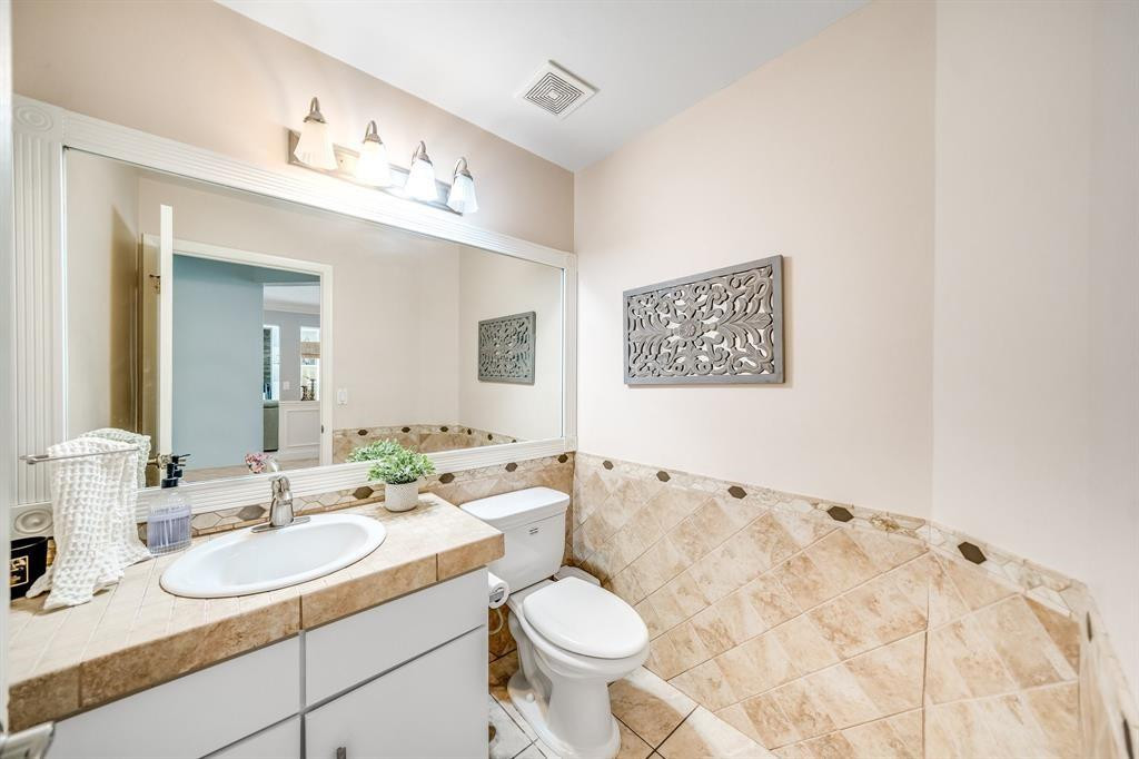 12036 Quilting Lane Boca Raton, FL 33428 - Photo 7 of 25 a bathroom with a sink and a mirror