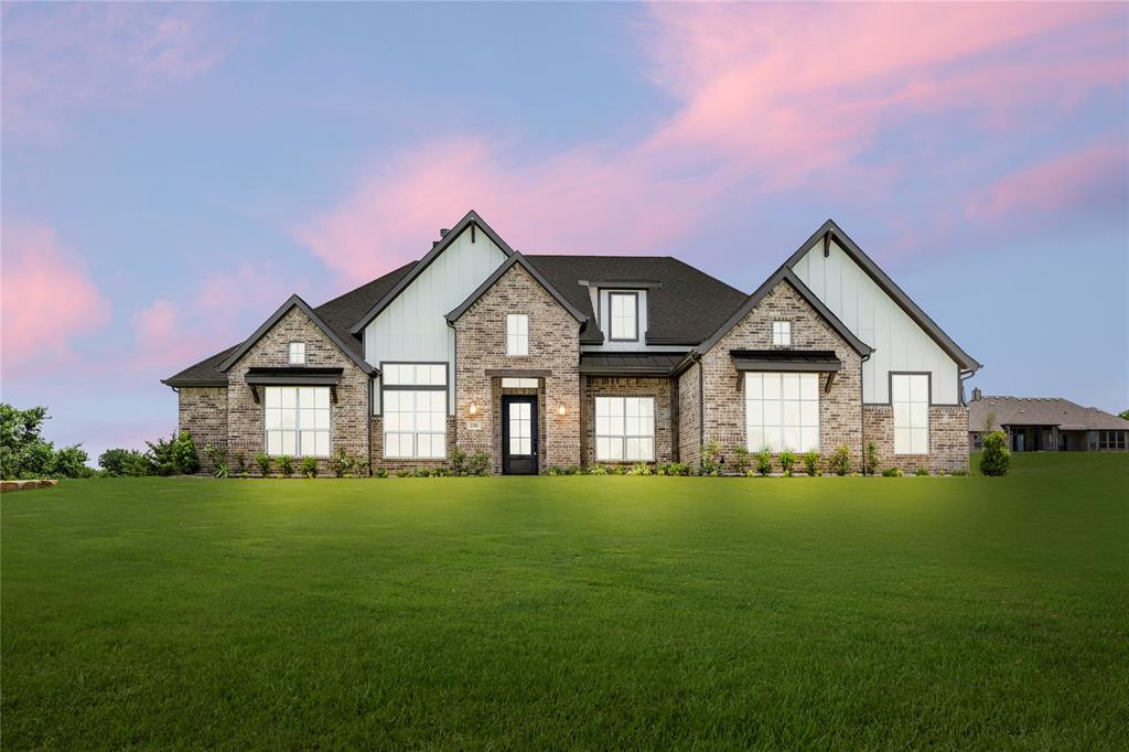 238 Carly Lane Van Alstyne, TX 75495 - Photo 1 of 1 a front view of a house with a yard and trees