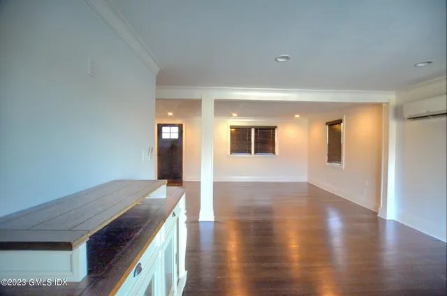 a view of a kitchen cabinets and wooden floor