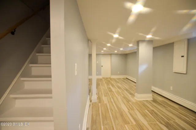 a view of a chair and table on the wooden floor
