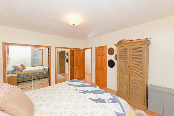 a bedroom with a bed and furniture