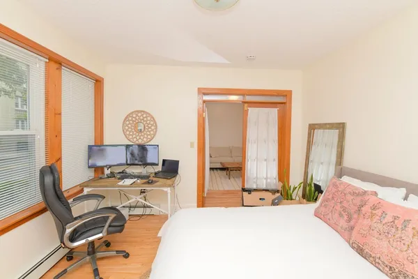 a bedroom with a bed and a table in it