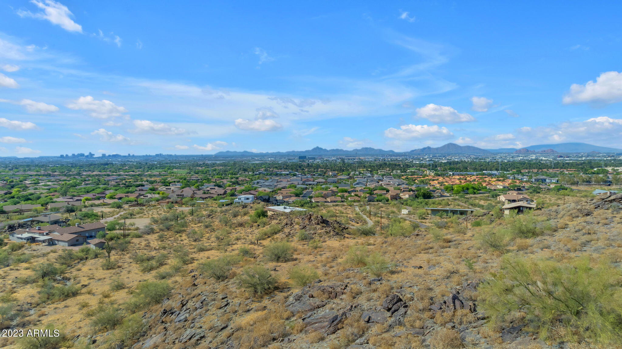 3425 East Highline Canal Road Phoenix, AZ 85042 - Photo 11 of 16 a view of a city with lots of trees