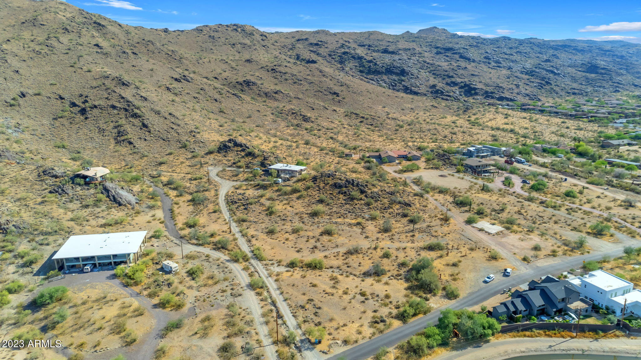 3425 East Highline Canal Road Phoenix, AZ 85042 - Photo 13 of 16 a view of a dry field with mountains in the background