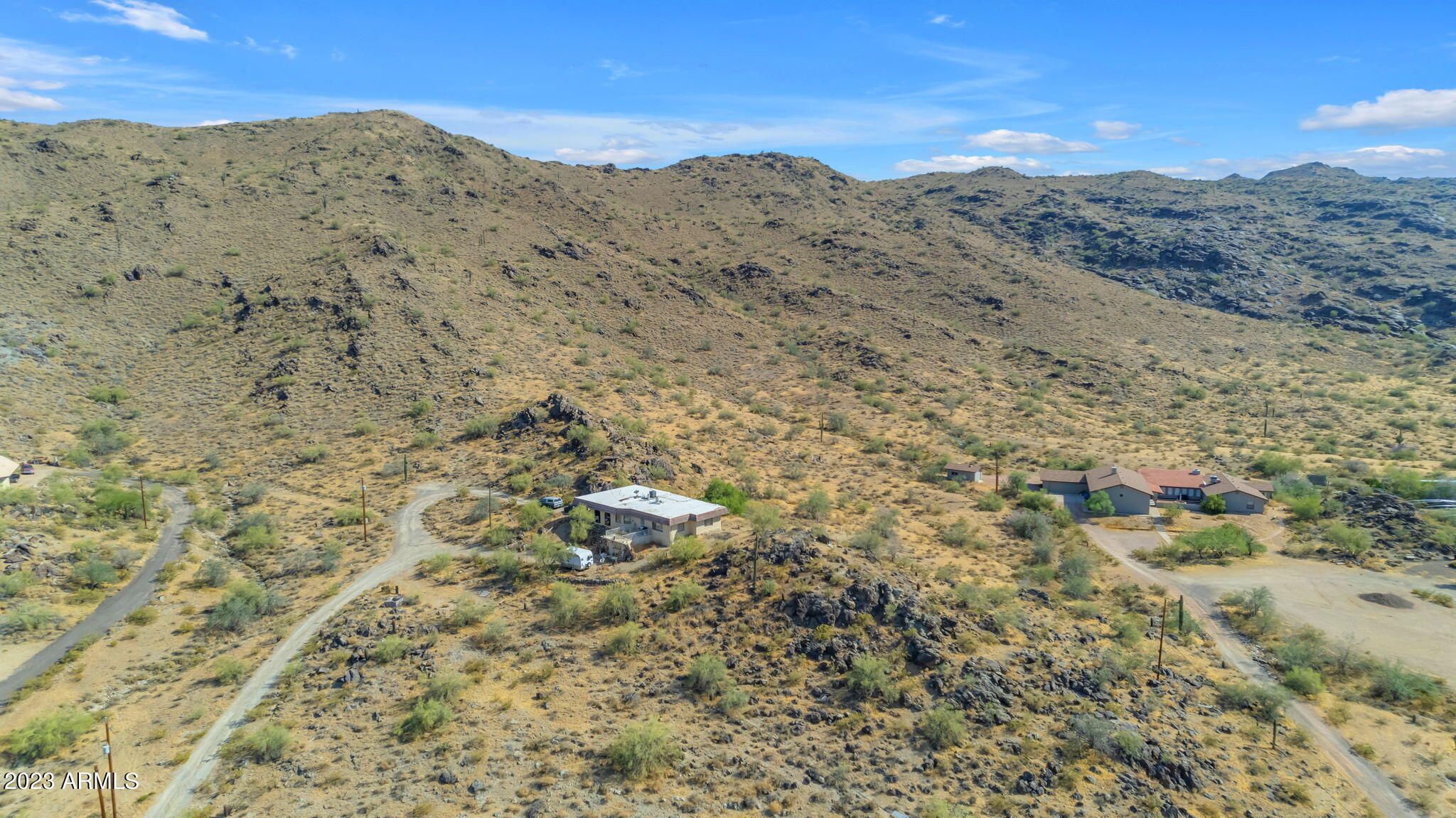 3425 East Highline Canal Road Phoenix, AZ 85042 - Photo 14 of 16 a view of a dry field with mountains in the background
