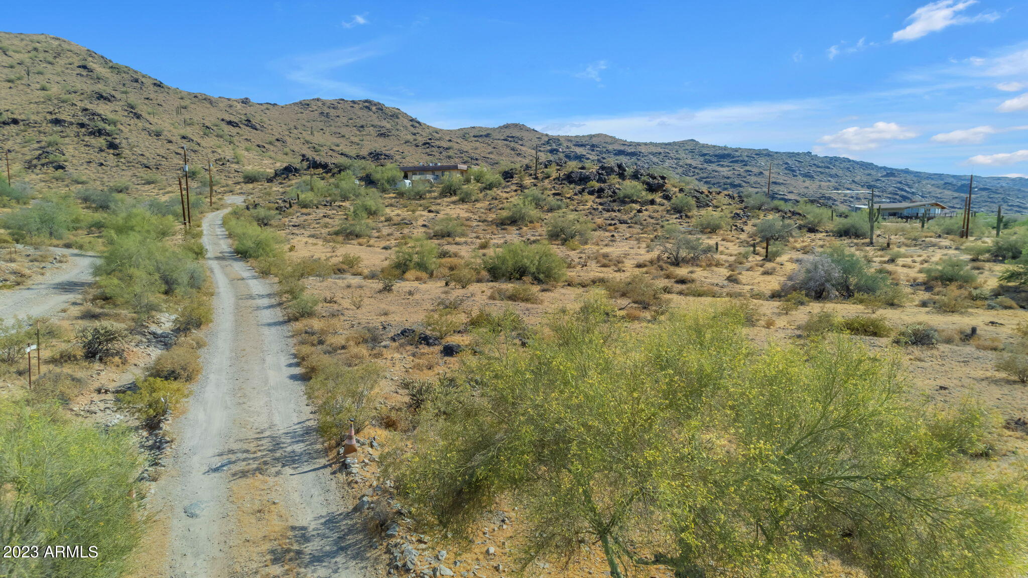 3425 East Highline Canal Road Phoenix, AZ 85042 - Photo 8 of 16 a view of a dry yard with mountains in the background