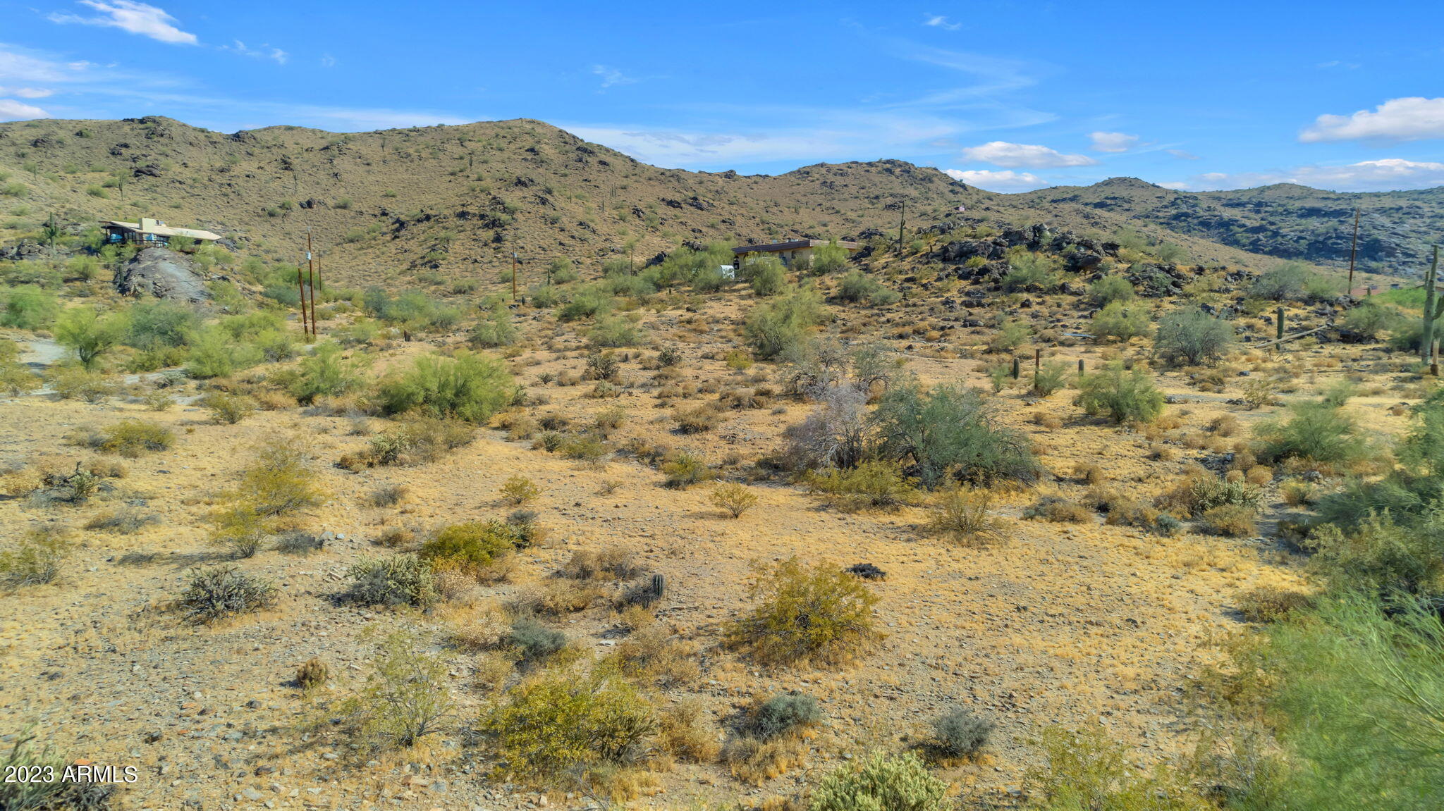 3425 East Highline Canal Road Phoenix, AZ 85042 - Photo 9 of 16 a view of a dry field with mountains in the background