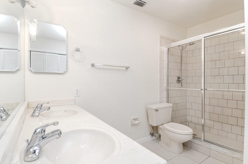 363 West Camino Real, Unit 4 Boca Raton, FL 33432 - Photo 21 of 37 a bathroom with a sink a toilet and shower
