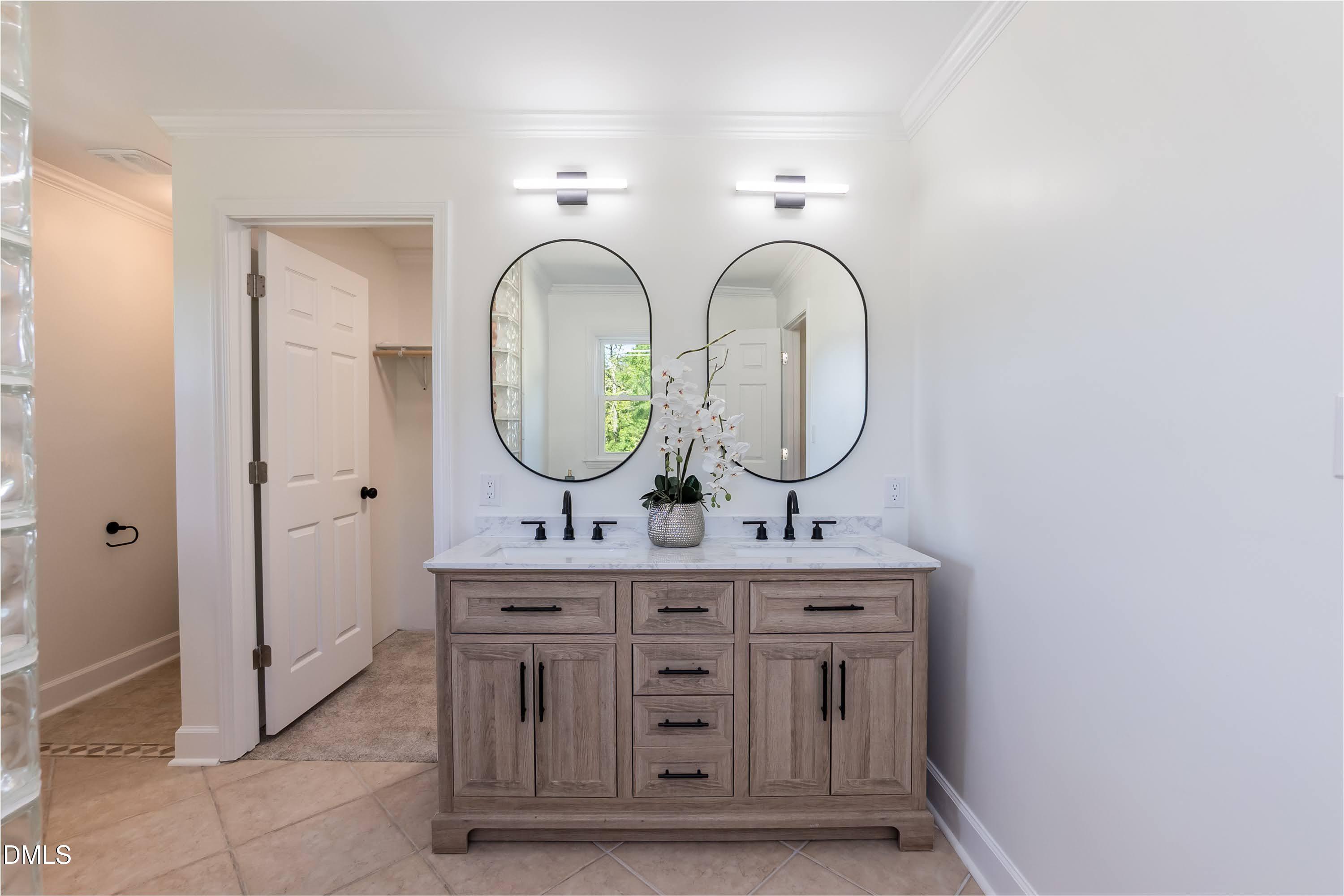 641 Rocky Ford Road Louisburg, NC 27549 - Photo 17 of 38 a view of bathroom with dual sinks