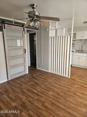 a view of a kitchen with a sink and cabinets