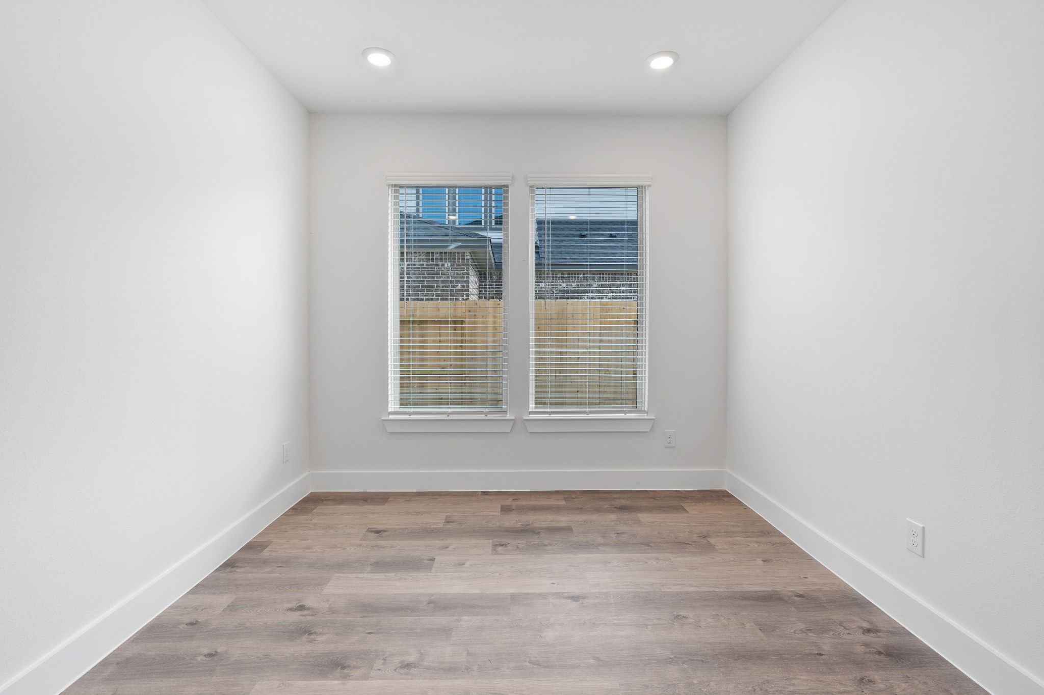 620 Cross Timbers Trace Waller, TX 77484 - Photo 11 of 36 an empty room with wooden floor and windows