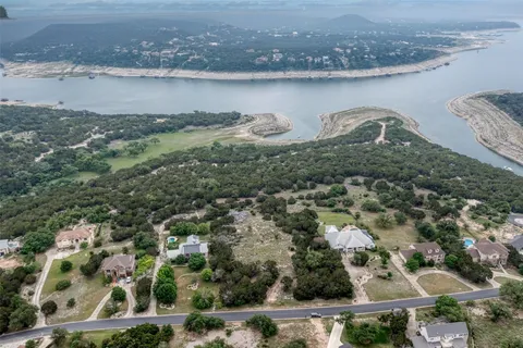 an aerial view of a house with a lake view