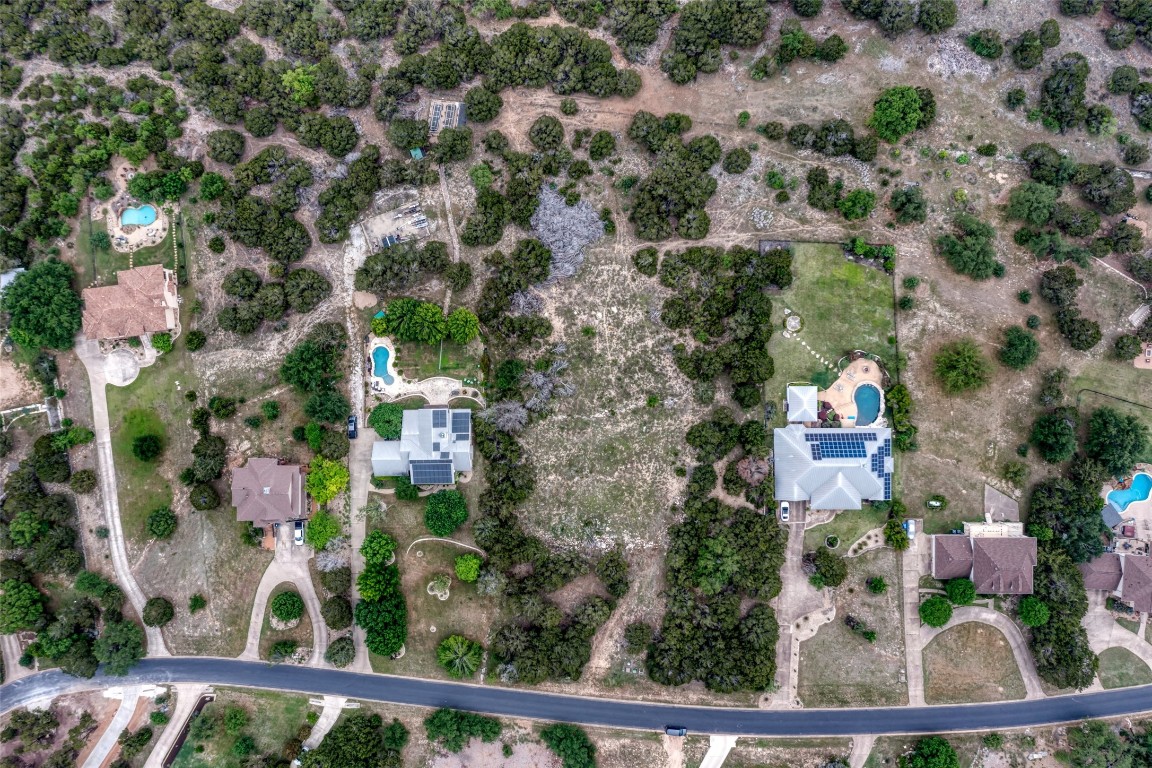 8111 Moon Rise Trail Jonestown, TX 78645 - Photo 7 of 12 an aerial view of residential house with outdoor space and trees all around