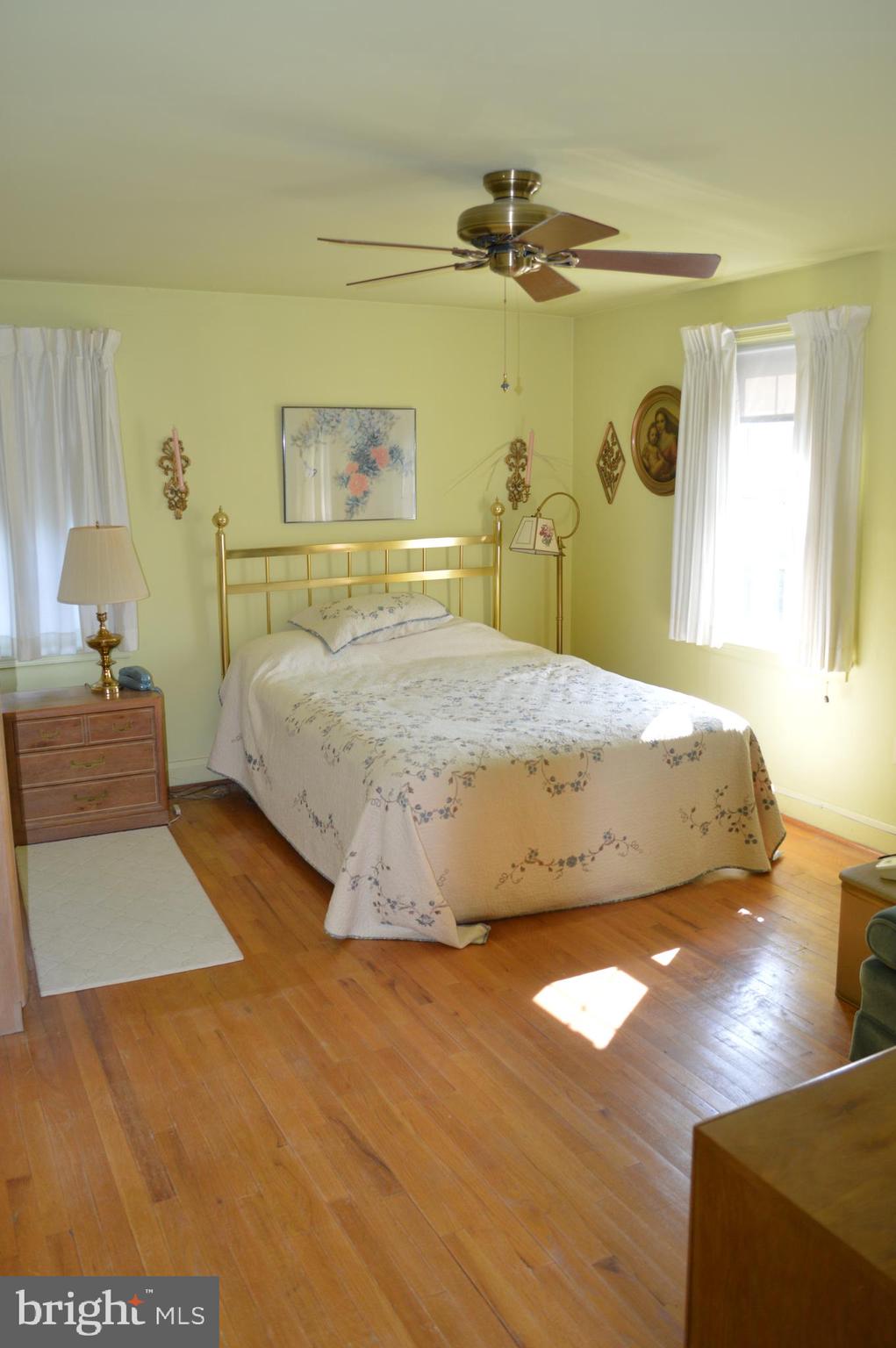 8110 Pleasant Plains Road Towson, MD 21286 - Photo 17 of 27 large master bedroom with hardwood floors