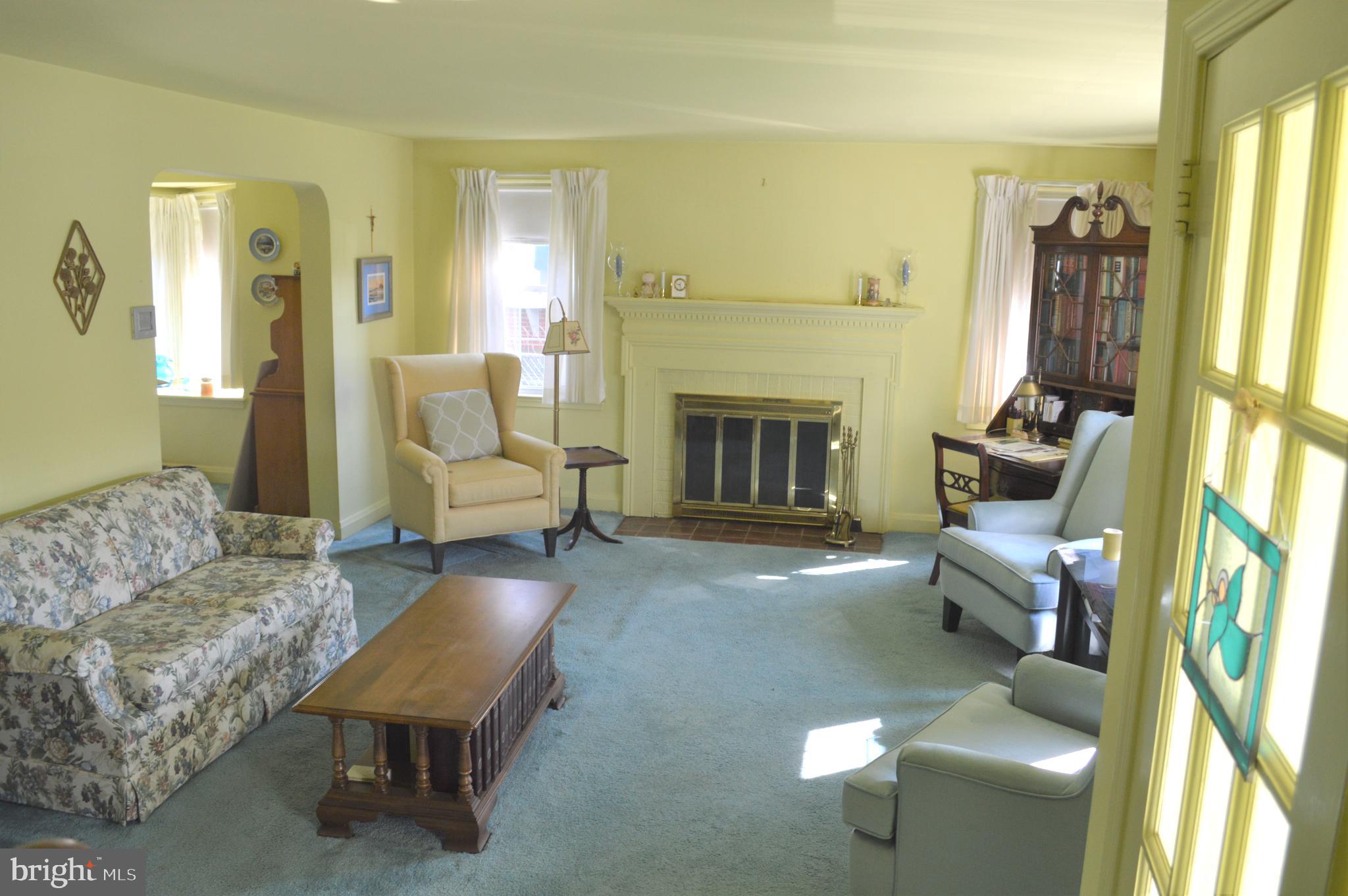 living room with wood burning fireplace