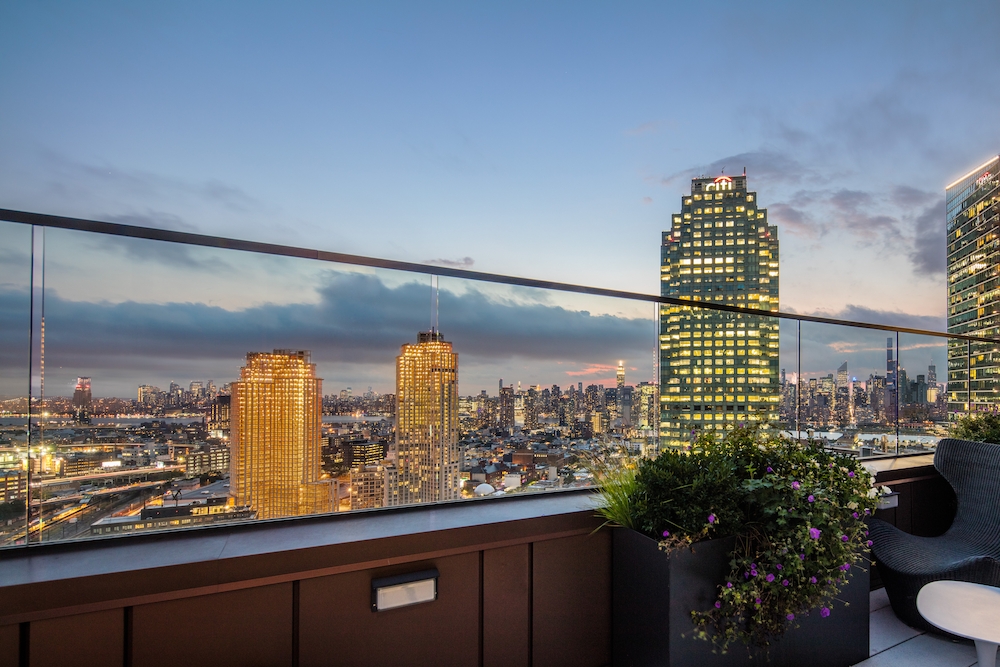 44-28 Purves Street, Unit 19B Queens, NY 11101 - Photo 15 of 19 a view of a city from a balcony