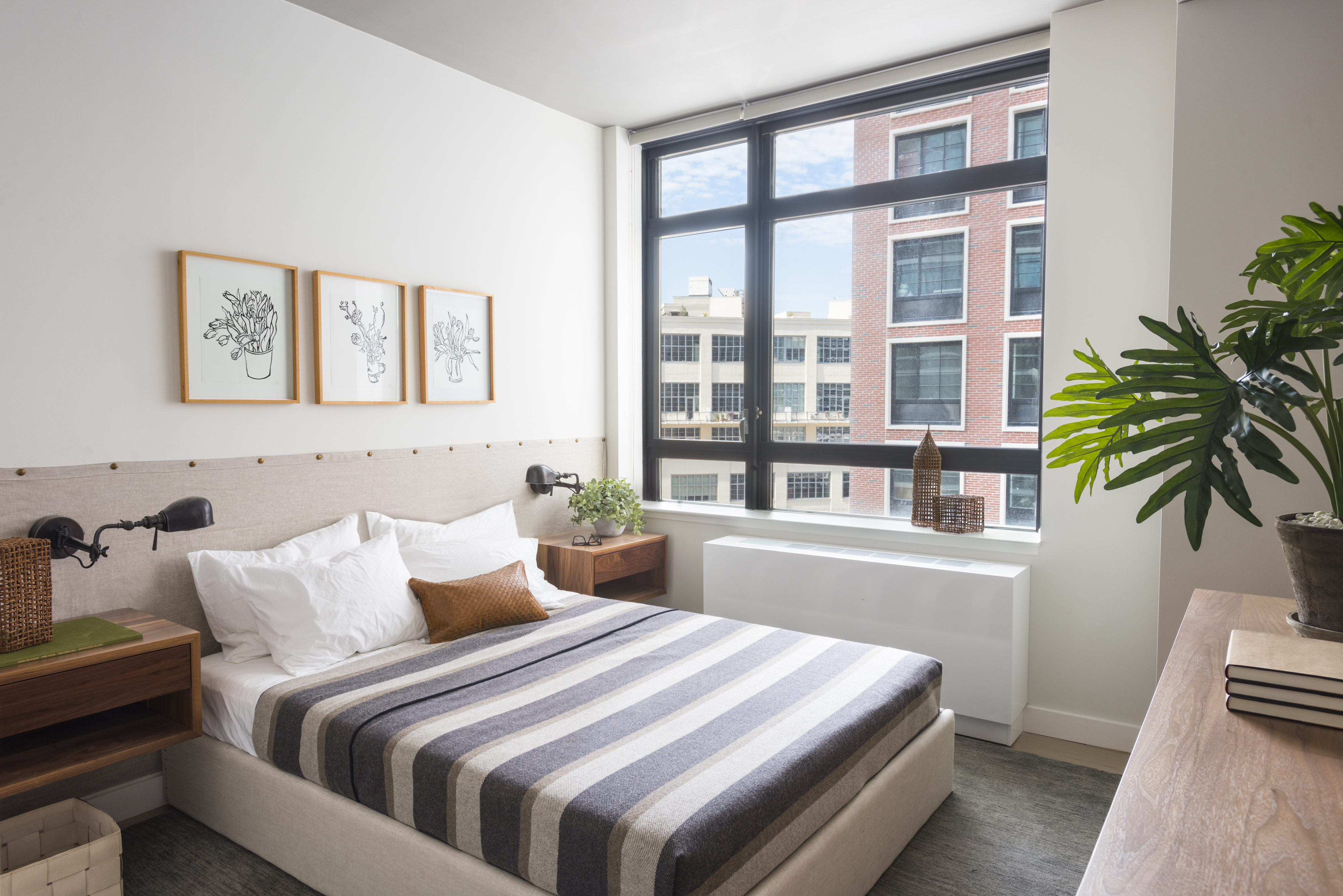 44-28 Purves Street, Unit 19B Queens, NY 11101 - Photo 2 of 19 a bedroom with bed and a window